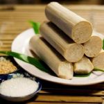 Ha Giang Loop Vegan Food & Allergy-Friendly Dining: Ultimate Travel Guide 7 A plate of bamboo rice sticks accompanied by a small bowl of salt, showcasing traditional Vietnamese cuisine.