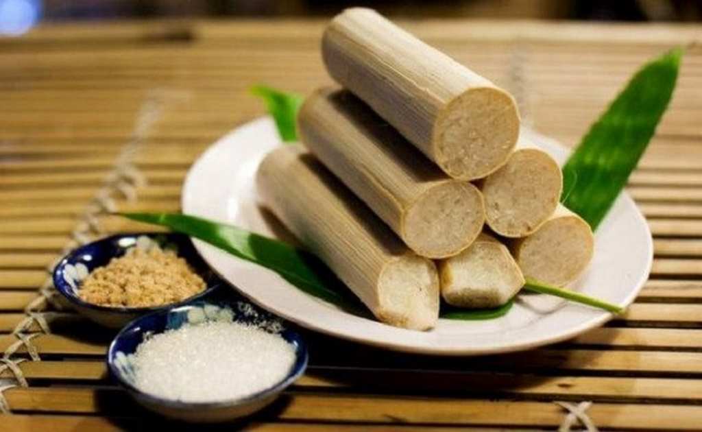 Ha Giang Loop Vegan Food & Allergy-Friendly Dining: Ultimate Travel Guide 1 A plate of bamboo rice sticks accompanied by a small bowl of salt, showcasing traditional Vietnamese cuisine.